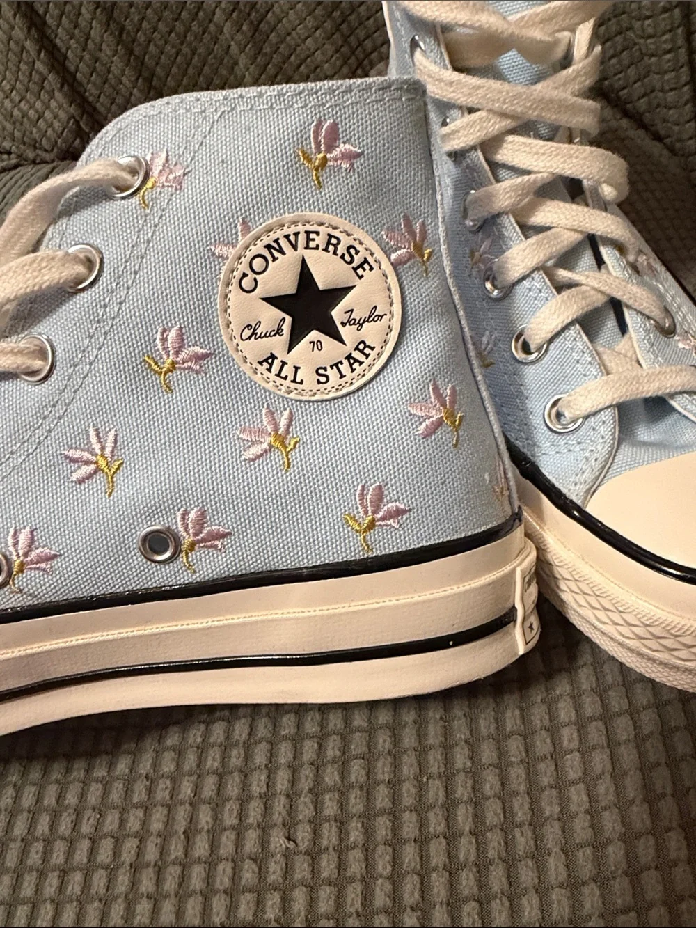 Converse Chuck Taylor light blue with purple flowers.   Mens 4. Womens 6